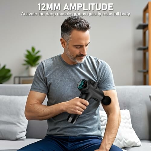 Man using massage gun on arm for muscle relaxation