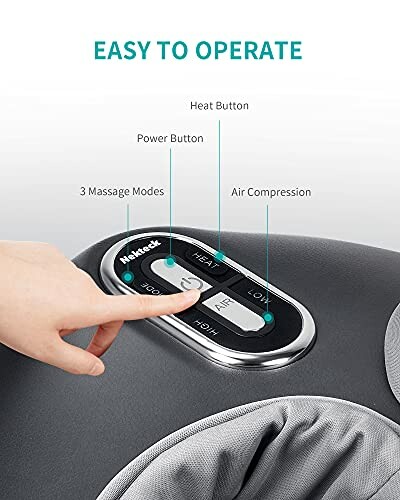 Finger pressing control panel of a massage device with labeled buttons.