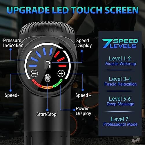 Massage gun with LED touch screen showing speed levels and indicators.